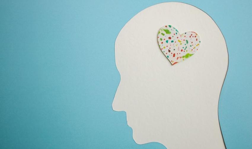 Image of head with colourful heart representing mental wellbeing