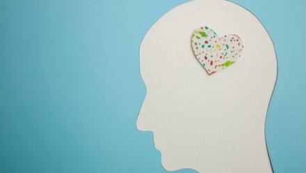 Image of head with colourful heart representing mental wellbeing