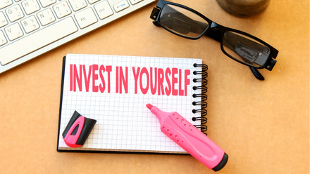 Notepad with the words Invest in Yourself