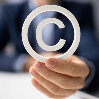 Image of person holding copyright symbol